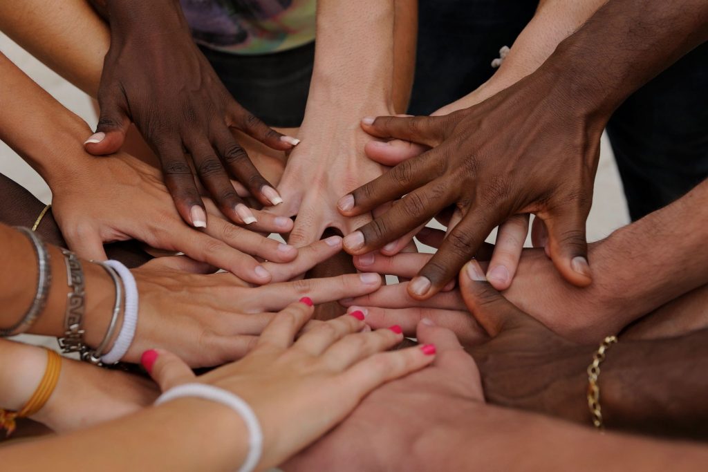 Interlinking multi-racial and multi-cultural hands for black history month.
